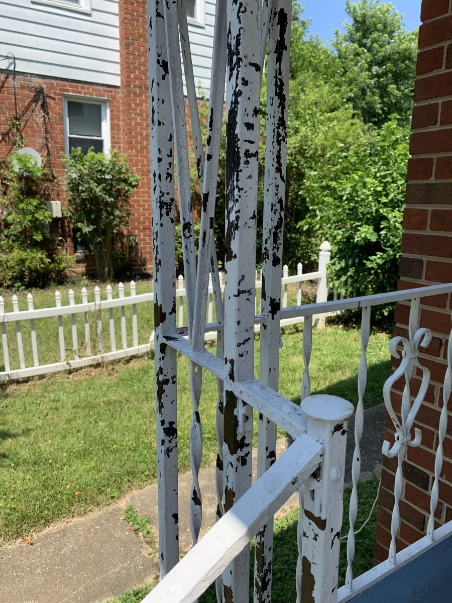 Painted exterior railing and property surfaces